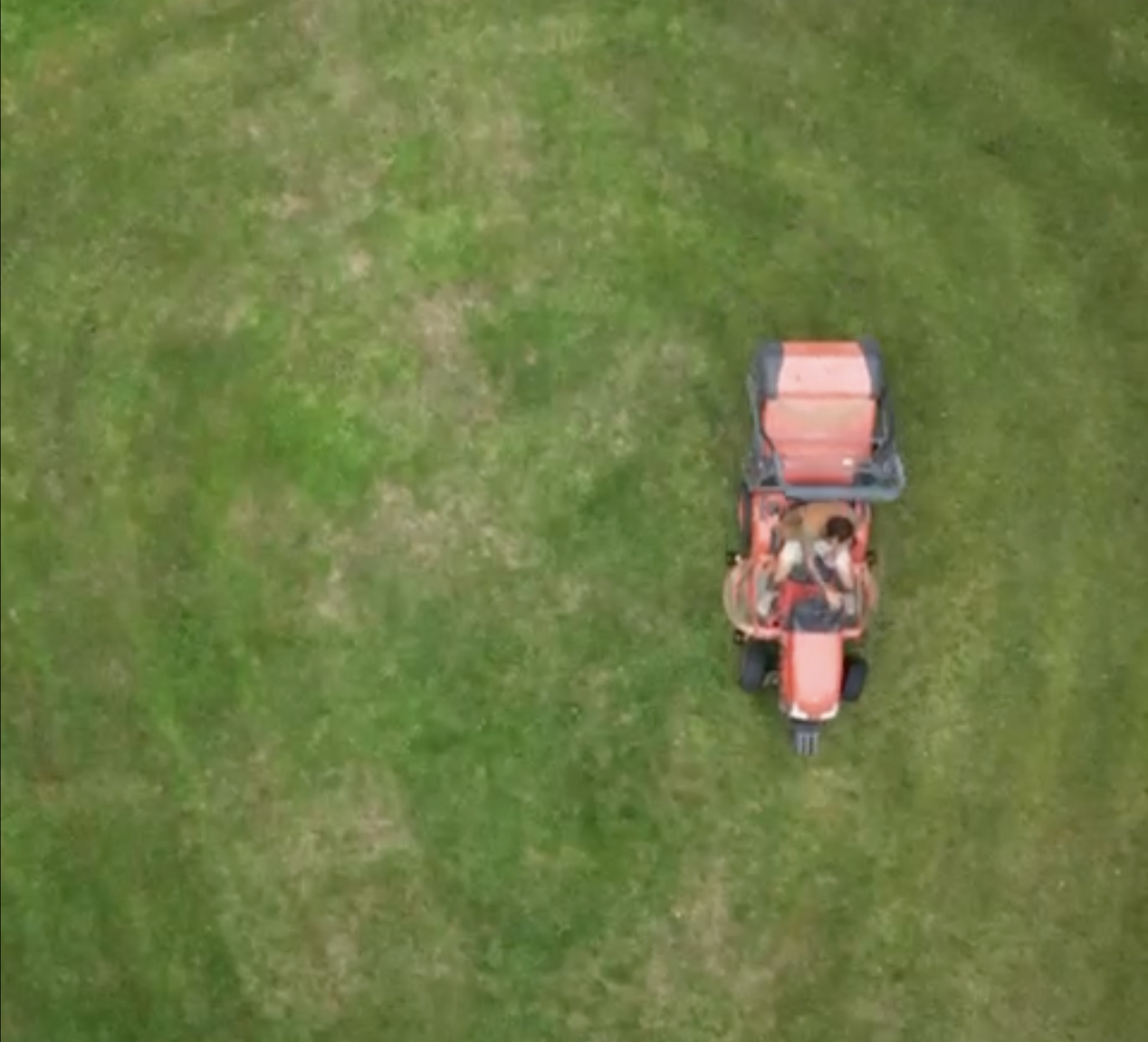 sit on lawn mower overhead shot